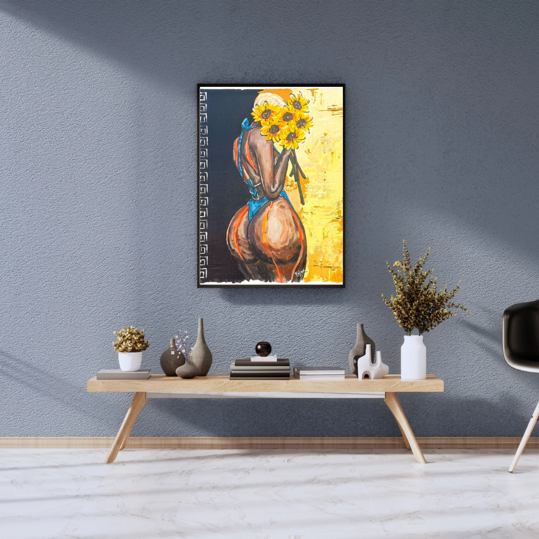 Melanin Sensation painting by Falex displayed in a black frame on a blue-grey wall above a wooden console table with decorative vases and dried flowers