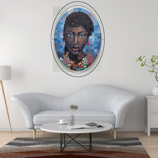 A Quiet Bloom V mixed media painting by Olamilekan Okunade displayed in an oval frame on a grey wall in a modern living room with a white sofa and round coffee table